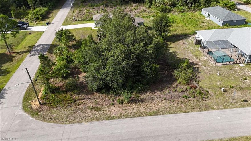 A great opportunity to own a spacious corner residential lot in the quiet, scenic community of Alva. This property offers added flexibility for home design, driveway placement, and curb appeal—perfect for a new build, a future investment, or anyone looking for extra breathing room.

 Property Highlights
Premium Corner Lot  
Wider frontage, easier access, and more design options for your future home, garage, or driveway layout.

Quiet, Rural Setting  
Enjoy the peaceful lifestyle Alva is known for—open skies, quiet streets, and a relaxed country feel.

No HOA or Restrictions  
Build freely without monthly fees or strict rules.

Plenty of Space  
Ideal for a large yard, garden, workshop, or outdoor living features.

Growing Area  
Surrounded by new homes and steady development, supporting long-term value.
 Location Benefits
Minutes to SR-80 for quick access to Fort Myers, I-75, and RSW Airport

Close to parks, boat ramps, and the Caloosahatchee River

Near schools, local shops, and dining

Easy commute to Labelle, Buckingham, and East Fort Myers

 Why This Corner Lot Stands Out
Corner lots offer better home orientation, more privacy, and enhanced curb appeal—giving you more flexibility and long-term value. Whether you’re building now or holding for the future, 2025 Robert Ave is a smart, versatile choice in a peaceful Alva location.

Click below for ariel view!
www.propertypanorama.com/instaview/fgcmls/2026022751