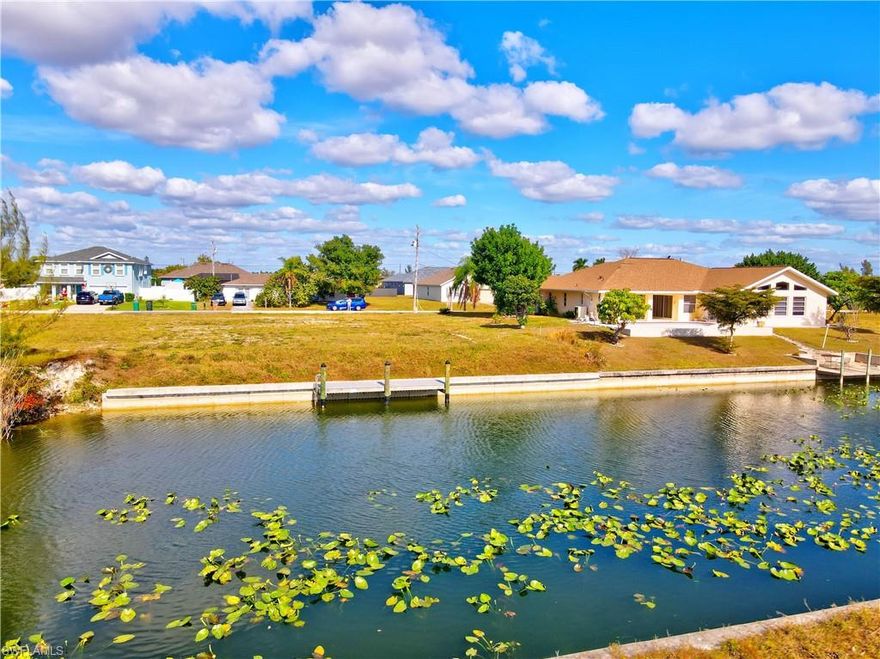 Prime freshwater canal lot located in the desirable Southwest Cape Coral area, just minutes from Veterans Parkway with quick access to shopping, dining, schools, and parks. This property features southern exposure, offering beautiful natural light and potential for stunning sunset views. A brand-new seawall and newly installed dock are already in place, adding immediate value and making this lot ideal for waterfront living. Surrounded
by newer construction homes, this homesite is ready for your vision—whether you’re planning to build a primary residence, a vacation retreat, or hold as a smart investment. City water, sewer, and irrigation are available, simplifying the building process. Enjoy the Southwest Florida lifestyle with nearby golf courses, restaurants, regional airports, and world-class beaches just a short drive away. Opportunities like this don’t come often—
secure your piece of waterfront Cape Coral today.