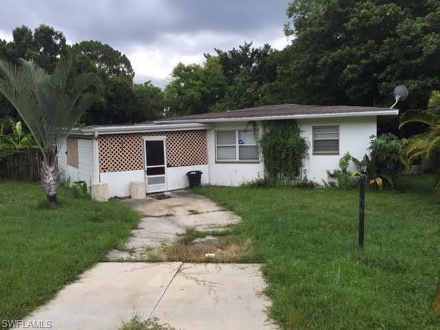Block home in North Fort Myers.   Home was a 3 bedroom 2 bathroom with a wall removed now is a 2/2.    Could easily be converted back.    Currently all the house needs is paint and flooring in one room and possibly the living area.   Yard needs a good cut.   House also has a newer kitchen and a HUGE wooden deck that is all covered for great outdoor living. Cash offers only.