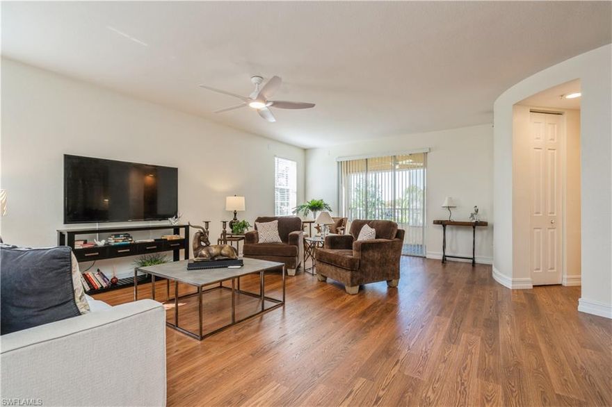 Lovely 2nd floor corner unit with extra windows that allows for natural lighting. Features include very open floor plan with foyer, great room, formal dining area or media room, light and bright eat-in kitchen with stainless steel appliances, abundant cabinets, recessed lights and slider to lanai. Spacious owners' suite with 2 walk-in closets and bathroom has large walk-in shower. Split bedroom plan offers privacy for guests and second bedroom is well sized and guest bathroom has tub/shower. Inside laundry with washer and dryer. New Mohawk Rev Wood Plus Laminate flooring throughout for easy maintenance. Some additional finishing touches include new fans, blinds, interior paint, and inside doors will accommodate a wheelchair. Sliders from great room open to screened lanai and offers a tranquil outdoor space to entertain and relax. From the moment you enter you will see all of the beautiful appointments and ready for new owners. Furnishings are available to purchase separately. The common elevator is very convenient, trash chute, covered parking, extra outside storage, plenty of additional parking, and new tile roofs in 2025. Van Loon Commons is gated with many amenities to enjoy including clubhouse with exercise room, billiards, and kitchen for gatherings. Community pool and spa have been redone. Very friendly and social community welcomes pets and has sidewalks through out. Fantastic location close to Pine Island corridor with shopping, dining, entertainment, medical facilities and easy access to Pine Island and Fort Myers. This is your opportunity to own this condo and enjoy carefree living in paradise.