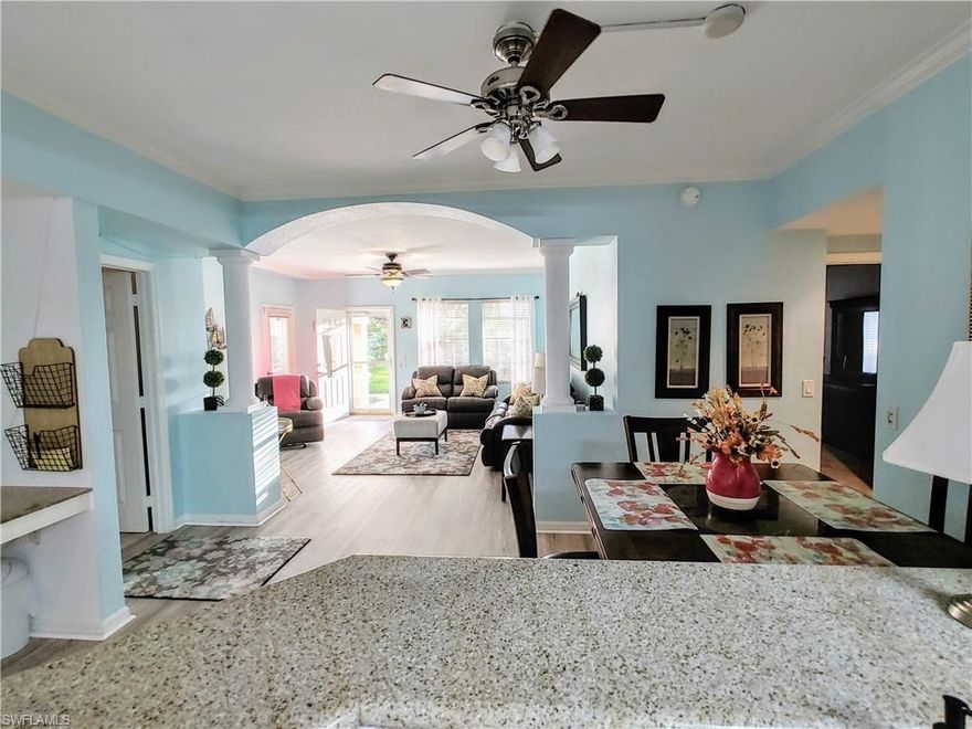 **HUGH REDUCTION of the monthly HOA Fees** !!One of the rare FIRST FLOOR two bedroom units in the community!! Introducing a delightful residence with an attached 2 car TANDEM-GARAGE upgraded with a garage door screen with charcoal fiberglass screen mesh and EPOXY flooring. This is a great opportunity for a beautiful and tasteful decorated two bedroom home with GRANITE COUNTER TOPS in kitchen and bathrooms. The kitchen comes with a BRAND NEW STAINLESS STEEL EXTRA LARGE and DEEP sink with an upgraded high arc single handle faucet with pull down sprayer as well as a newer side-by-side refrigerator and a high-end SAMSUNG dishwasher. The shower features an amazing rain shower head including a frameless glass door. The hot water heater is just a few years young. The FLOORING in living and dining area and kitchen has been UPDATED with beautiful High Quality LAMINATE. Nestled in a serene and private neighborhood in North East Cape Coral, a highly desirable area. This charming condo is the perfect residence or second home for those looking to enjoy the Southwest Florida lifestyle without any outside maintenance. EVERYTHING is INCL. in the HOA fees. The Owner pays only for electricity. This amazing immaculate well maintained unit boasts a bright and welcoming atmosphere with tons of natural light flowing through its spacious living area. Just a short walk to the gorgeous pool, well-equipped gym and clubhouse. Enjoy the Florida sunshine in the screen-enclosed lanai with your morning coffee or soak up the sun by the stunning infinity edge community pool with spa overlooking the 5 acre lake, the centerpiece of this very active community. Conveniently located close to a shopping plaza with a Publix supermarket and restaurants as well as Highway 41, providing easy access to all the amenities and attractions that the area has to offer like shops, beaches, international (Fort Myers) and national (Punta Gorda) airports. Don't let this fantastic opportunity pass you by – schedule a tour today and make this charming condo your own slice of paradise in Sunny Florida! NEW ROOFS in 2024 (paid by insurance) ! **NO SPEC. ASSESSMENT for the new roofs** !! NO FLOOD ZONE !!