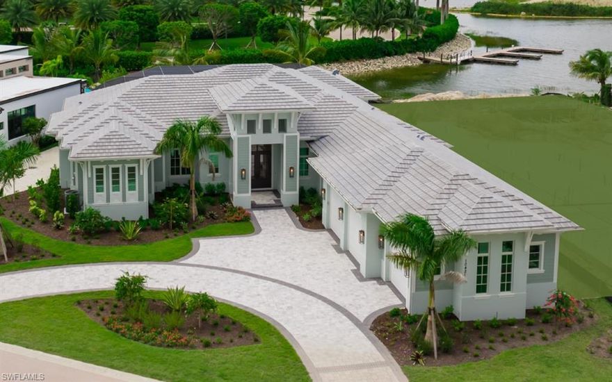 Newly Constructed by Gulf Shore Homes, this beautifully appointed home has expansive rooms with high ceilings, modern lighting, and large windows that flood the home with natural light. The open concept kitchen, living, and dining areas are designed for entertaining, with sleek custom cabinetry, state-of-the-art appliances, and large island. Master bedroom suite has three (oversized closets) walk in closets, all guest bedrooms are oversized en-suite with large closets. Travertine floors throughout would add a touch of luxury, providing both durability and elegance. The layout provides a seamless flow between indoor and outdoor spaces, with the over sized pool being a centerpiece of the outdoor space, featuring sitting area with bio thermal fireplace, outdoor dining, water and gas hookup for your summer kitchen and boat dock. Over 1100 square ft of garage space, circle driveway, 2 tankless hot water heaters, crown molding, vaulted ceilings, custom cabinetry and so much more! Miromar Lakes features 700 acres of freshwater lakes, with two marinas, boating, fishing, swimming, water skiing, 3 miles of sand beaches, two gourmet restaurants with culinary chef, club house, pool, full-service spa, fitness center, bocce crts, golf, tennis and pickleball along with an onsite amenities' director with ongoing social activities. Miromar is just 10 minutes from Southwest International Airport and next to Florida Gulf Coast University with large shopping malls within minutes.