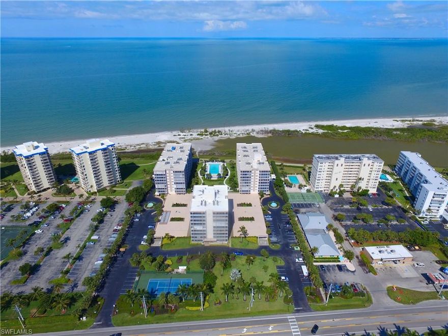 C.16290 - Corner unit on the 6th floor with Great views! Wrap around balcony with sliding doors. Open tiled kitchen with breakfast bar. Turnkey furnished. The furniture is newer with coastal flair. Under building parking. A/C was put in in 2016 and hot water heater 2013. Very nice clean residence. Creciente is located right across from the shopping center Santini Marina Plaza. Large pool with activities every week during the season. Exercise room, tennis and so much more. 1 year home warranty included valued at 995.00 on all appliances and plumbing with Home Tech.