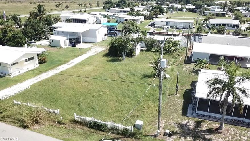 This is your opportunity to live in one of the best boating communities is SWFL. This large 80’x180’ lot is ready for your new construction or can accommodate most manufactured/mobile homes. It has a boat dock with sea wall on a 60 ft width canal with plenty of room for a boat lift. You have direct access to Redfish Pass and Gulf of Mexico. with no bridges! The lot has septic, water and electric and no impact fees. The Flamingo Bay Community located in Saint James City, on Pine Island, has a voluntary HOA fee of only $150/yr. with a one-time initiation fee of $500. Amenities include community boat ramp, clubhouse and heated pool. they have activities of bingo, card games, dances, shuffleboard, and horseshoes. Pine Island provides a laid-back rural feel with access to everything you need within a short drive. There are major supermarkets, pharmacies, tennis courts, a golf course, banks, churches, and plenty of restaurants.