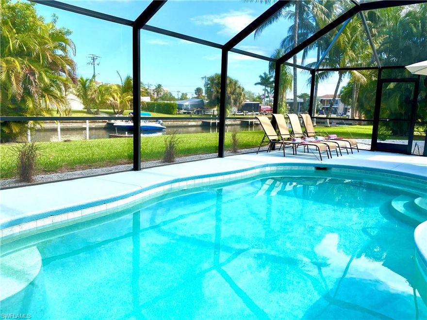 PRICE REDUCED*** Owner will review every offer***
Yacht Club area ** Gulf Access** Welcome to your Cape Coral Vacation Oasis! Offered Furnished and Turnkey, this 3 Bedroom , 2 Bath POOL home is perfect for enjoying the best of what Southwest Florida Offers: Boating, Sunshine and Freedom. Gulf Access just 4 minutes to open waters of the Gulf of Mexico with one bridge, no community rules and $0 HOA fees. New AC in 2019 ** New flooring in 2019 ** New contemporary bathrooms in 2019 *** with a Charming Side Yard versatile for Gardening or Pets to Play. New large Pool cage in 2019 *** New Poolheater in 2019***.  Kitchen with stainless steel appliances is great for entertaining: sleek modern countertops, lots of cabinets with open views of the water have been over-layed on charming original home details. Actually a vacation rental, great care has been taken to outfit home for comfort and enjoyment. Laundry room. Located in the best part of Cape Coral for proximity to gulf AND to  restaurants, businesses and cultural events. ASSESSMENTS paid in FULL.  Contact your Agent today to schedule a VIRTUAL or in-person tour.