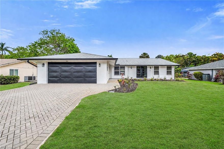 One or more photo(s) has been virtually staged, AI generated or rendered.  This APPEALING 3-bedroom, 2-bath single-family home offers 1,744 sq ft of living space under air and features an updated kitchen with new cabinets and countertops, wide-plank vinyl flooring throughout, and a primary bath with a walk-in shower. Situated on a larger lot with a fully fenced backyard, it provides excellent privacy and is ideal for pet owners or anyone seeking a peaceful, secluded setting. Conveniently located just 15 minutes from downtown Naples and close to Hibiscus Golf Club as well as the Mustang and Flamingo public golf courses in Lely, this home blends comfort, convenience, and a sense of quiet retreat. One of the LOWEST HOA'S in the area!