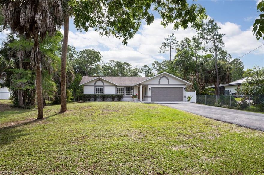 One or more photo(s) has been virtually staged, AI generated or rendered.  Welcome home to a stunningly remodeled single-family retreat where modern elegance meets relaxed, spacious living--all set on an impressive 1.14-acre lot. The property features newly installed mulch, rock and refreshed landscaping, enhancing its curb appeal from the moment you arrive. As you step inside, the home's fresh, contemporary feel shines through.  Enjoy new luxury vinyl flooring, crisp interior and exterior paint, updated baseboards and trim, and stylish new doors throughout. Architectural highlights such as cathedral and tray ceilings add character and dimension, while modern lighting and fixtures add the perfect finishing touch.  At the heart of the home, the fully remodeled kitchen is sure to impress.  Featuring sleek white cabinetry, gorgeous quartz countertops, and a full suite of stainless steel appliances...including a wine cooler...it's as functional as it is beautiful.  The open layout flows effortlessly into the expansive family room and out to the pool area, creating a perfect setup for entertaining. You'll find 3 generously sized bedrooms offering custom built-in shelving & abundant storage in each bedroom closet and 2 beautifully updated bathrooms with new vanities and quartz countertops designed with both comfort and versatility in mind. The former 2-car garage has been thoughtfully converted into a flexible bonus space-ideal for a home office, gym, studio or extra storage.  Prefer a garage?  It can easily be restored, giving you total flexibility as your needs evolve.   Behind the scenes, major upgrades like a full PEX replumb, newer water heater, and a brand-new whole home reverse osmosis system with a 300-gallon tank ensure comfort and peace of mind.   Step outside and discover your own private oasis.  The covered lanai overlooks a screened-in sparkling pool and spa, all surrounded by a large paver deck perfect for relaxing or hosting guests. In addition, the backyard features a versatile workshop/shed outfitted with water and electric—ideal for hobbies, projects, or extra storage. The property is equipped with labeled storm shutters for added convenience and peace of mind.  The sprawling 1.14 acre lot provides ample space for additional structures such as a detached garage, barn, or guest house. With a newer roof and countless upgrades throughout, this move-in ready home offers comfort, style and endless possibilities--inside and out.  Located close-in, allowing quick access to Wilson Blvd., Collier Blvd., Pine Ridge and Vanderbilt Beach Rd.