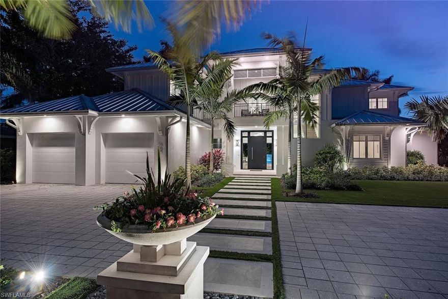 Offering an ultimate vacation like feel this newly constructed Old Naples cottage style home was designed by MHK and built with meticulous detail and to exacting standards. Situated on an oversized south facing lot this residence offers a generous and light filled open floor plan which seamlessly flows to a resort like oasis including a 41' pool, spa, artificial turf yard, and a large covered outdoor living space with gas grill completely secured by automated screens and shutters.  The layout offers a first floor master bedroom with direct access to the outdoor living, first level study, and 3 en suite bedrooms plus living and loft space upstairs including a separately accessed cabana. Many custom details throughout, some of which include wide plank oak flooring, top end appliances and finishes, wet bar, LED lighting, electric and gas heat for pool, 2 tankless water heaters, and a 2 + golf cart garage which has space for car lifts if needed. Completed in 2017 this custom home offers an unrivaled combination of quality, location, layout, and value.