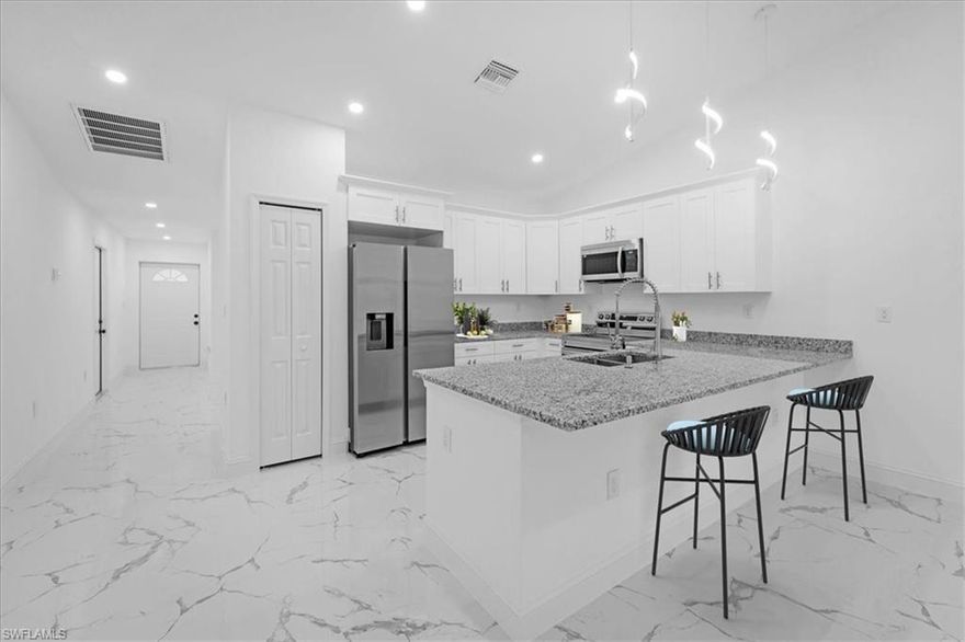 Become the fortunate owner of this excellent source of income property and take advantage of the easier pre-qualification with one of our preferred lenders offering closing costs and down payment assistance. Unique building design of six bedrooms and four bathrooms total. 24x24 porcelain tile throughout, granite or quartz countertops, stainless steel appliances, modern light fixtures, frameless glass shower door in master bath. It offers tub and shower combo, led lights, designer wood cabinetry, security system with cameras, sprinkler system, breathtaking property for sure. Located in one of the best areas of Lehigh Acres, close to shopping centers and main roads. One of the biggest duplex in town on an oversized lot. Just Completed 2024.