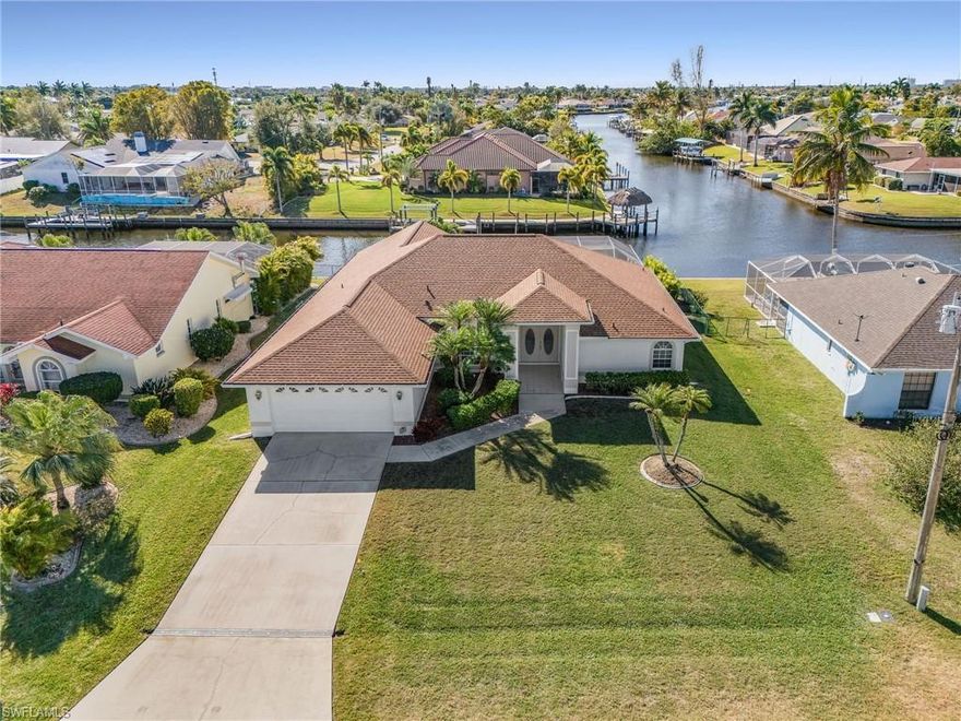 Step inside and be instantly drawn to sweeping canal views that set the tone for this beautifully maintained, one-owner home in the heart of SE Cape Coral. Centrally located and close to restaurants, grocery stores, shops, salons, and everyday conveniences, this home offers the perfect blend of comfort, location, and Florida charm.

Designed for both relaxing and entertaining, this 4-bedroom, 3 full-bath home features a 2-car garage, two spacious living areas, and a formal dining room—ideal for gatherings big or small. The generous layout includes a large laundry room, two walk-in showers, and a shower/tub combo, offering flexibility for family and guests.

Outside, your private oasis awaits with a pool and spa overlooking the canal, perfect for unwinding, entertaining, or soaking up the Florida sunshine year-round.

Enjoy peace of mind with major updates already completed:
Roof (2023), Appliances (2023), Pool screen (2023), Exterior door (2020) This is more than a house—it’s a lifestyle. Come see it today and start living the Florida dream