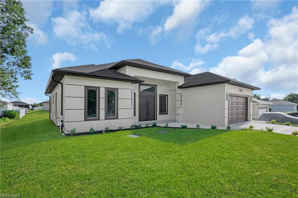 Photo of 2506 51st ST SW, LEHIGH ACRES, FL 33976 (MLS # 226019988)