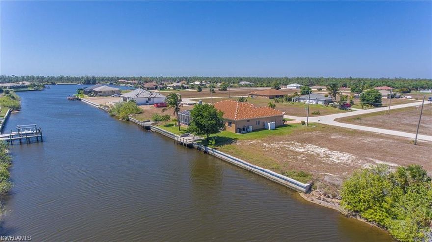 Prime Gulf access canal-front lot on the Eastover Canal with direct boating access via one bridge to the North Spreader Waterway and onward to Matlacha Pass and the Gulf of Mexico. Property includes an existing seawall, reducing development costs and accelerating build timelines. Located near the Crystal Lake Park redevelopment, enhancing long-term appreciation potential. Ideal for residential construction or waterfront investment. Quicksilver Canal Bridge