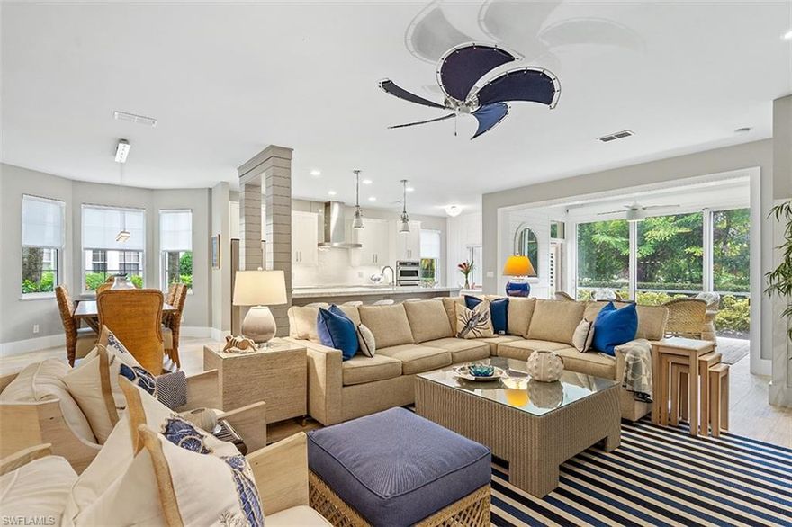 ONE of only 2 renovations of this type & level in the community & within 15 minutes of downtown, the beaches, Waterside Shops & Mercato. Beautifully reimagined to open concept living, this coach home lives like a single family home! A 13 ft. island separates the spaces, custom cabinetry throughout, a dream kitchen with everything you can imagine, fabulous quartz countertops, a master bathroom to die for with 5x7 shower, dual shower heads, all custom tile, fabulous translucent glass door to commode room and amazing lighting. Flooring is hardwood look large plank tile except for bedrooms, including the sun room that was enclosed with floor to ceiling glass sliding doors that have an automated sun screen for privacy. All new impact glass doors & windows. Open the sliders and enjoy the breezes or close them and use year round. Beautiful white wood shutters in all other spaces. Shiplap touches throughout including foyer and sun room ceilings. Conveniently located on an extremely quiet cul-de-sac you are only steps away from the fitness center and pool. This home is truly for the most discerning buyer who is ready to unpack and start enjoying life!