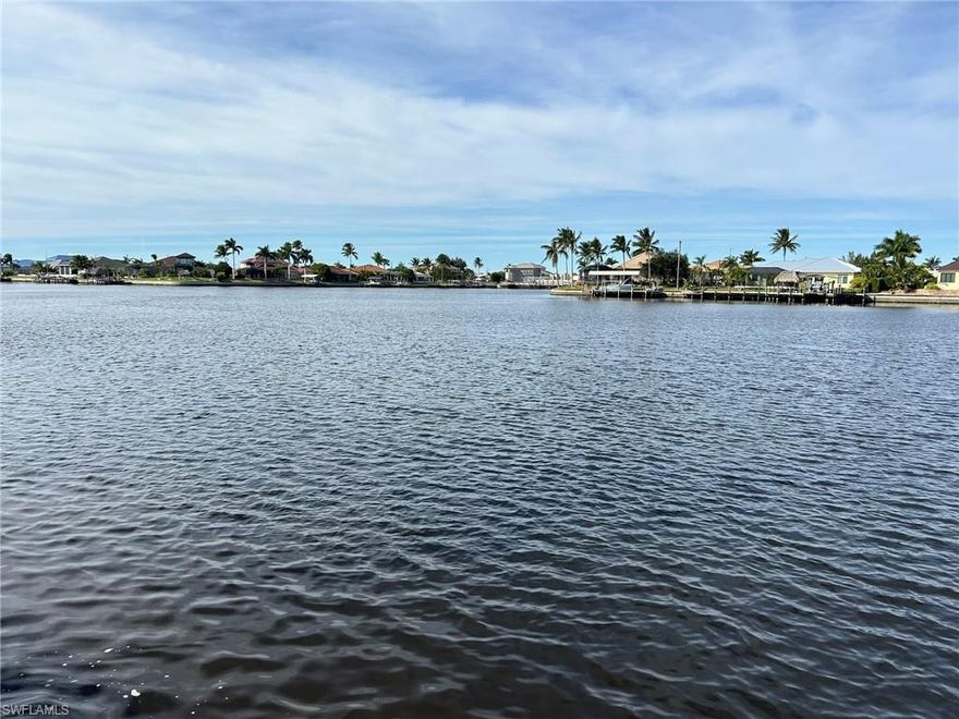 Build Your Dream Home in the Private Gated Community of West Cape Estates. Huge Water View overlooking Wazee Lake.  Direct Boating Access, no bridges. Enjoy the Paver roadway lined with Royal Palms, Street Lamps and Paver walkway. Pickle Ball and Tennis Court next to the Community Building which has Fitness Equipment  and Restrooms. This is a rare opportunity and the last Gulf Access Lot in the Development to offered for sale. Don't Miss Out.