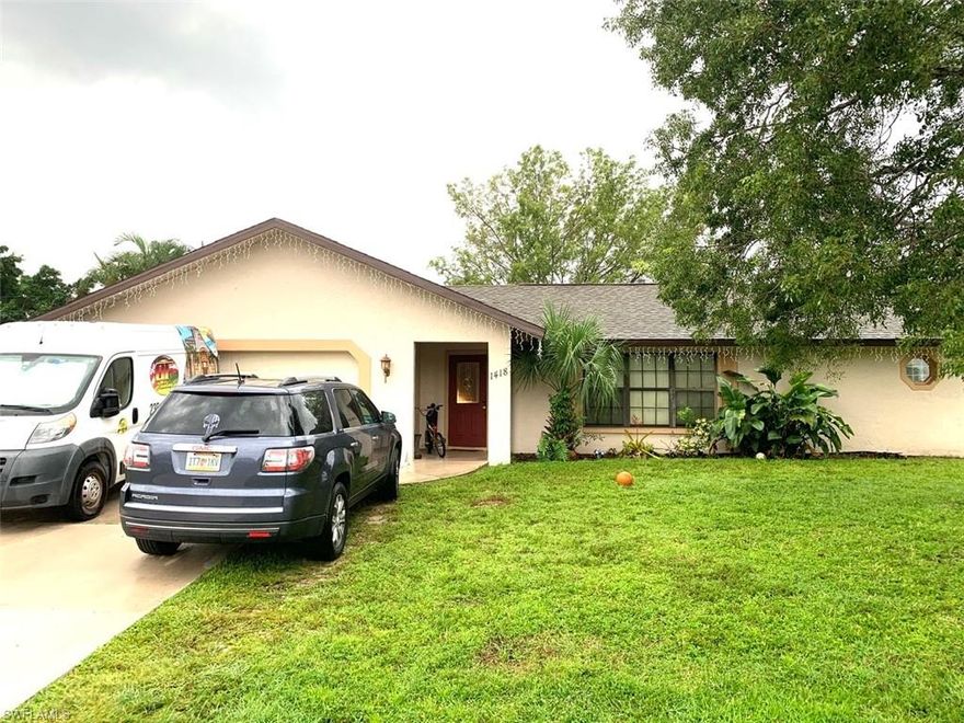 Great location near midpoint bridge, open kitchen, large lanai, sunken LR, walk in shower in master bath. Large three bedroom two bath home. This one will go fast. Popular location close to Veterans Pkwy. Three bedroom split floor plan with sunken living room, large kitchen with pass through window to huge screened lanai. Big back yard, laundry hook up in garage, tile and carpet. Assessments IN and PAID