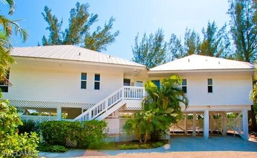 Private and pristine, this classic Captiva estate offers over 170 feet of beach frontage along one of the most beautiful beaches in the United States on Captiva's Gold Coast. Comprised of a main home, a guest home and a large tropical and secluded pool, "Side-by-Side" embodies the feel of the quintessential Captiva getaway. With over an acre of land and over 170 feet of frontage, the views of sugar sand beaches and sparkling Gulf waters from both the main and guest home are panoramic and breathtaking. The property offers two beach paths (one for each home), multiple lanais, mature tropical vegetation and a bright inviting feel from almost every room. Let your cares drift away with the breeze as you watch the sun slowly sink into the Gulf of Mexico. These homes have been meticulously maintained in the quaint "Old Florida" style. Whether enjoying a tropical family getaway, or a wonderful income stream through vacation rentals, this property is a true Captiva gem. Furnishings can be purchased separately.