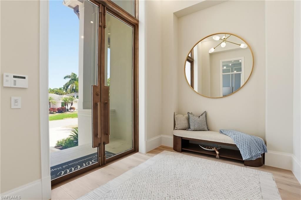 Photo of 626 Fountainhead LN, NAPLES, FL 34103 (MLS # 226013306)