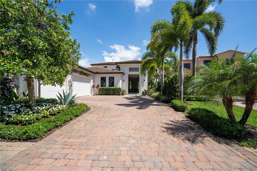 A rare opportunity to purchase a spectacular home is available in the Lucarno neighborhood of Mediterra. As you step inside, prepare to fall in love with the chef's kitchen, which is equipped with high-end appliances, a gas cooktop, and a large island. Attention to detail is impressive as you walk throughout this exquisite home, showcasing volume ceilings with exposed beams, an abundance of natural light, & gorgeous hardwood flooring. The unique corner lot location provides additional privacy, and multiple lake views from two sides of the residence. The panoramic lake views are truly a showstopper overlooking the inviting resort-style pool & spa. This immaculately-maintained residence features an expansive outdoor living space complete with an outdoor kitchen, large living area, dining area, and gas fire pit. It is finished with a spa-like master retreat with a soaking tub and glass-enclosed shower with multiple shower heads. Ideally located in the award-winning community of Mediterra, it features a private club with two world-class Tom Fazio golf courses, a private beach club, tennis, a restaurant, and is just a short distance to Southwest Florida's gorgeous white sand beaches.