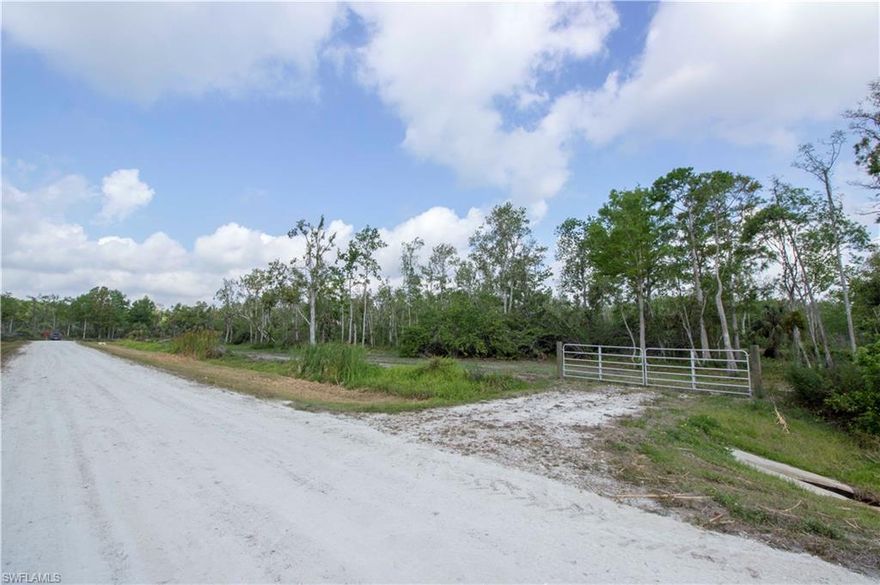 This breathtaking 2.81 acre woodland retreat, just 30 minutes from Naples white sandy beaches can now be yours.  Over 185 feet of freshwater canal  and adjacent to the 68,000 acre Corkscrew Sanctuary bordering the  West side of the property.