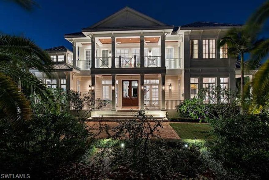 H.15145 - Coastal glamour & classic elegance! Exceptional 2014 smart home. Top line features & fixtures, 4 doors from the Gulf! Wood floors, tons of windows, island influence design in the very heart of Olde Naples near the best restaurants, shops,galleries in SWFL! Designed for gracious entertaining inside & out. Spacious & inviting! Luxurious 1st floor master suite, w/2  huge closets. Elevator to 3 roomy guest suites w/balcony access. Separate 4th VIP guest suite w/kitchenette & balcony; 3 car gar. Enormous chef’s kitchen; trough sink, six burner Wolf gas range, SubZero fridge, Wolf steamer, 2 Bosch dishwashers. Big island & dining table topped w/gorgeous “Mystery White" marble slabs, 'crisp white w/crystalline feathering' Lots of seating & prep space; open to grand family room & formal dining. Lofty vaulted, wood paneled, beamed ceilings, transom windows, walls of white  glass fronted cabinets. Tons of light, most rooms open onto lanai w/pool/spa/full kitchen, 2 story cypress ceiling, cupola, clerestory windows; recessed electric screens. Lush palms, tropical landscaping for privacy. Colorful sunset skies to enjoy while lounging on lanai/pool float. Feels Like a 5 star resort!