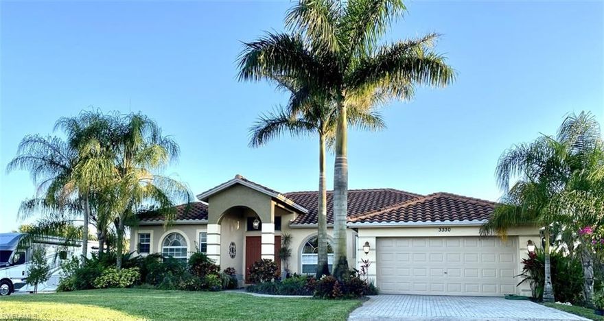 ***PRICE REDUCED FOR QUICK CLOSING *** BEAUTIFUL home w/1838 living sq. and a total of 2720 sq. ft. w/Tile roof, adult lush landscaping, royal palms. high ceilings & entryway, Foyer, living, dining, kitchen with breakfast bar, breakfast nook w/bay window, family room overlooking trussed-in, screened-in lanai. This elegant home's design includes coffer ceiling, rounded corners, double door high entryway.  Spacious spa-like master bath w/dual sinks, spacious step-in shower, Roman tub, 2 walk-in closets with mirrored doors. Fenced-in, spacious cleared backyard w/fruit trees.  Located near public golfing, Ave Maria University, Publix, CVS, Dunkin Donuts, restaurants, fire rescue, etc. Now is the time to enjoy the Naples Golden Gate Estates lifestyle you have been dreaming of.
