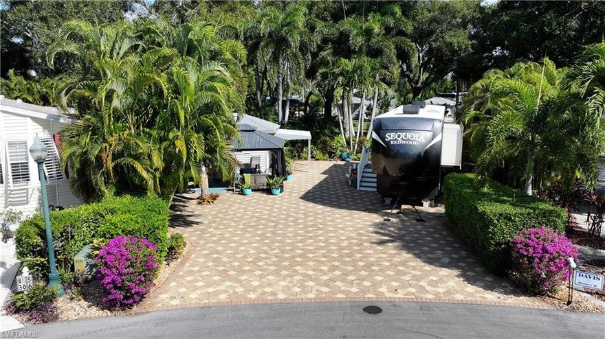 Discover Lot B37 — a beautifully maintained, oversized pie-shaped RV lot located in one of the quietest circles within Cypress Woods RV Resort in Fort Myers, Florida. Offering over 5,400 sq ft of fully pavered space, this property backs to a large, shaded common area featuring a stunning canopy of mature oak trees, providing exceptional privacy and a serene natural setting.
The lot is surrounded by lush tropical foliage and rock landscaping that enhances the resort feel. A 12x16 hardtop gazebo with electric provides the ideal outdoor living space for relaxing, dining, or entertaining.
The fully finished accessory building offers impressive functionality with tile flooring, a refrigerator, Murphy bed, toilet, shower, sink, ample storage, a canopy extension, and additional rear storage lockers. All patio furniture is included, making this property move-in ready.
Located in a gated, pet-friendly community, Cypress Woods RV Resort offers top-tier amenities including two heated pools, hot tubs, pickleball, billiards, shuffleboard, a fitness center, and a clubhouse with year-round activities.
HOA fees are $1,087 per quarter and include lawn care, cable, water, sewer, fiber optic high-speed internet, and full use of all resort amenities.
Class A, Fifth Wheel, and Class C RVs are welcome. This spacious, private, and meticulously maintained lot is an exceptional opportunity for those seeking premium resort living in southwest Florida.