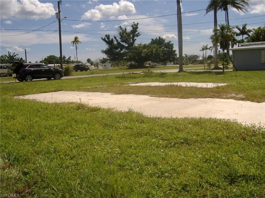 Large lot 80x90 in Flamingo Bay is ready to put your new manufactured home on with NO Impact fee. There was a home removed from the lot so it had water, electric and sewer on the lot to hook up. Need new pole for electric. You own the land and can join the voluntary home owners association for $150 a year and have use of the community pool, clubhouse, boat ramp with access to Red Fish pass & Gulf of Mexico & some of the best fishing in SW Florida. You will be close to restaurant's, banks, grocery stores and church.