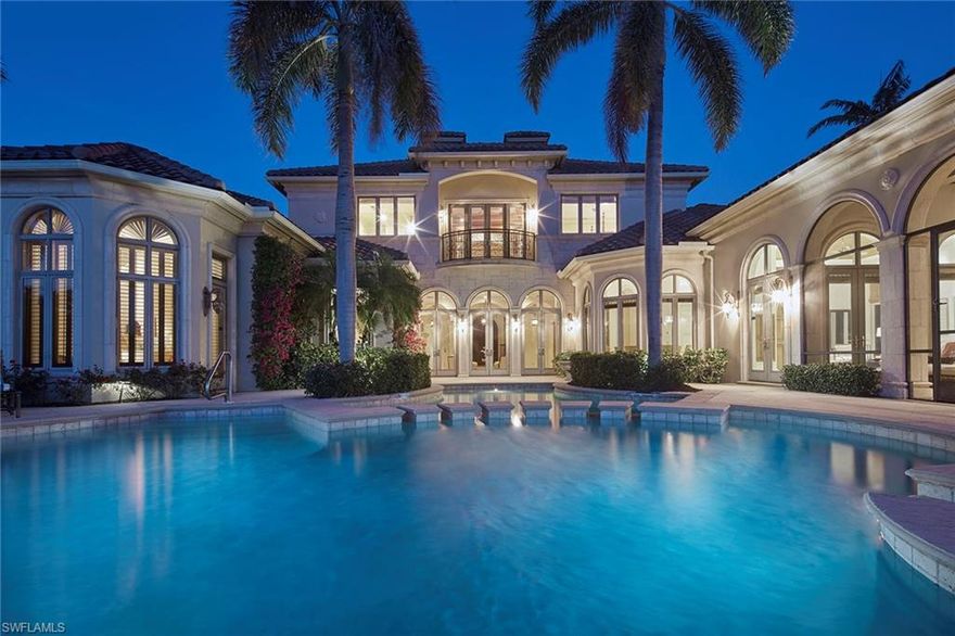 Immediate Grey Oaks Full Golf Membership Available! This extraordinary former estate model is in the exclusive Estuary at Grey Oaks community on a serene, private .75-acre homesite with lake and double fairway views of the Estuary golf course. The classic exterior architecture includes extensive precast stone, a private motor court with four-car garage and an opulent classical garden with fountain. The five-bedroom, six-and-one-half-bath home has a dramatic soaring two-story foyer, elegant ceiling detail throughout and neutral marble flooring. Designed for entertaining, this custom estate home features a private media room and a fantastic outdoor living space with covered screened-in lanai with stone gas fireplace, summer kitchen with bar and an infinity-edge pool and spa all overlooking one of the best lake and golf course views in all of Grey Oaks. Additional features include a luxurious main suite with dual baths, whole-home generator, climate-controlled wine cellar, gourmet-equipped kitchen with butler's pantry, private elevator and a spacious, detached cabana guest suite. A world of luxury awaits you in Grey Oaks just minutes from the world-class dining, shopping and beaches of Old Naples. The award-winning Grey Oaks Country Club includes three 18-hole championship golf courses, two elegant clubhouses, an incredible lagoon beach-entry pool, indoor and outdoor restaurant and bar, pickleball and tennis center, golf training facility, and a lavish 30,000-square-foot health and wellness center.