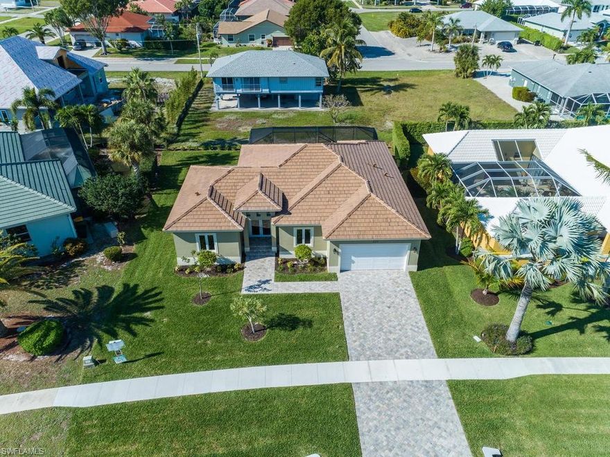 New Construction | Completed January 2019. Centrally located to the YMCA, Mackle Park, library, museum and Racquet Center. Beautiful wood tile throughout, granite countertops in kitchen and in separate laundry room. Stainless Steel appliances in kitchen with breakfast bar and hidden pantry. Quartz counter tops in all three bathrooms. Master bedroom has two separate walk in closets. Master bathroom has dual sinks, separate soaking tub and shower. Impact glass windows and doors throughout, foldaway slider in great room. Large screened pool area and lanai.