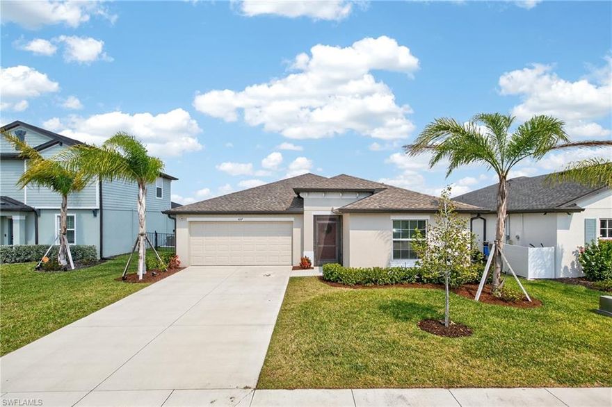Built in 2024 and located on a quiet cul-de-sac street in the Crane Landing community of North Fort Myers, this well-maintained 4-bedroom, 2-bath single-family home offers 1,937 square feet of living space with a bright open great room floor plan designed for modern living. The main living area features tile flooring, abundant natural light, and a seamless flow between the kitchen, dining, and living spaces, creating a comfortable setting for both everyday life and entertaining. The spacious kitchen is designed for real functionality, featuring a large center island, stainless steel appliances, generous cabinet storage, and a walk-in pantry. The split-bedroom layout provides privacy for the primary suite, which includes a large walk-in closet, dual sinks, and a walk-in shower, while three additional bedrooms offer flexibility for family members, guests, or a home office. The current owners have added several thoughtful upgrades including a fully fenced backyard, gutters, and an upgraded garage door opener. One of the most attractive features of this property is the large backyard that backs to a permanent community green space that will not be developed, providing an open feel along with a corner view of one of Crane Landing’s scenic lakes, while still leaving ample room to add a future pool or expanded outdoor living area. Crane Landing is known as a quiet but active newer community offering amenities that include pickleball courts, tennis courts, basketball court, community park, playground, fishing pier, and sidewalks throughout the neighborhood, creating opportunities for both recreation and relaxation. The community is conveniently located near shopping, restaurants, grocery stores, and everyday conveniences, with easy access to Del Prado Boulevard, Downtown Fort Myers, Cape Coral, and I-75, making it a practical option for commuters while still offering a peaceful residential setting.