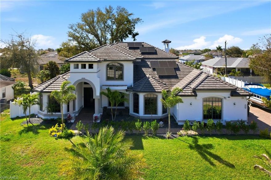 Look at this Custom-Built Stunning Luxury Two-Story Pool Home with 5 Bedrooms and 4.5 Bathrooms on a Triple Lot in Cape Coral. This Fully Solar Powered Energy Efficient Home features a Private Heated Swimming Pool and Spa, 4-Bay Garage, Fully Fenced Yard with New Lush Tropical Landscaping, and City Water and Sewer. The Concrete Tile Roof offers an estimated 30–50 Year Lifespan and minimal maintenance. New Exterior Landscaping showcases Sylvester Palm Trees with Orange Glaze creating a lush tropical look that is hardy, drought-tolerant, and low maintenance. Flower Beds, Bushes, Updated Irrigation, Automated In-Ground Drip System, and LED Landscape Lighting enhance the curb appeal. Enter through Elegant French Doors into Soaring 24-Foot Volume Ceilings highlighted by a Grand Handcrafted Staircase. The Main Living Area features a Spacious Living Room with Fireplace and Wet Bar perfect for entertaining. Additional Living Areas include a Family Room with Wood-Burning Fireplace, Formal Dining Room, and Breakfast Nook. The Gourmet Kitchen features Imported Italian Granite Countertops, Designer Soft-Close Cabinetry, GE Profile Appliances, and a Large Walk-In Pantry. The Laundry Room includes GE Profile Washer and Dryer, Cabinetry, Sink, Counterspace, and Utility Closet.
The First-Floor Owner’s Suite offers a Private Retreat with Electric Fireplace, Sitting Room with Beverage Bar, Two Walk-In Closets, and Private Access to the Pool Lanai. The Spa-Inspired Bathroom includes Dual Vanities, Soaking Tub, Walk-In Shower, and access to an Additional Bedroom or Home Office with Natural Light. The First Floor also includes a Guest Suite with Private Entrance and Full Bathroom. Upstairs you will find a Second Master Suite with Private Newly Screened Balcony, Guest Bedroom, Full Bathroom, and Bonus Game Room with Bar and second Balcony. The Home features Three New Rheem Variable-Speed HVAC Systems installed in 2025 providing advance Climate Control and Indoor Air Quality. Step outside to the Resort-Style Screened Lanai with Outdoor Kitchen, Gas Grill, Wet Bar, Covered Seating Area, Paver Pool Deck, and Heated Pool and Spa. The Pool features New LED Lighting and a Newly Painted Cage with Upgraded Screens. The Backyard includes New Fencing, Motion Sensor Lighting, and over 2,000 Square Feet of Premium TigerTurf Artificial Grass with Underground Drainage for year-round green lawn with minimal maintenance. All Four Garage Spaces include High-Efficiency Ductless Mini-Split A/C Systems and the Attic has been Fully Insulated. Additional upgrades include New Pool Equipment, Updated Electrical Panels with Whole-House Surge Protection, and Hurricane Roll-Down Screens. Located in a Non-Gated Neighborhood with No HOA, this Property offers convenient access to Fort Myers, Golf Courses, Boat Ramps, Shopping, Dining, and Southwest Florida Beaches.
