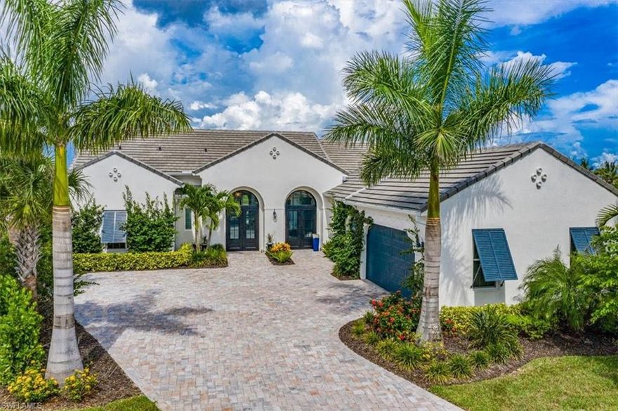 H11095 - Coastal influence w designer touches, offering custom light fixtures & window treatments, beautiful tile & wood flooring, cathedral & beamed ceilings w built-ins for superb architectural design. A masterfully designed kitchen offers a generous breakfast bar open to the living room with pocketed sliders that lead to the beautiful outdoor oasis. 4 spacious en suite bedrooms, your guests and family will appreciate. The fabulous stone wine wall will impress & the formal dining room is the perfect space for gatherings. You’re going to appreciate gorgeous SWFL sunrises over the lake from your spacious lanai complete w outdoor kitchen, spacious covered seating area all overlooking your custom pool w sundeck & integrated spa. Peace of mind will be yours w impact windows & doors, a full house Generac generator & automatic Kevlar hurricane shades. Live Life well at Fiddler’s Creek where you will enjoy the clubhouse and spa, resort pools w water slide & hot tub, state of the art fitness center inc. sauna, variety of classes, tennis, pickleball, walking trails, preserves & mangroves. Golf the championship golf course. Beach memberships are available at Tarpon Club on Marco Island.