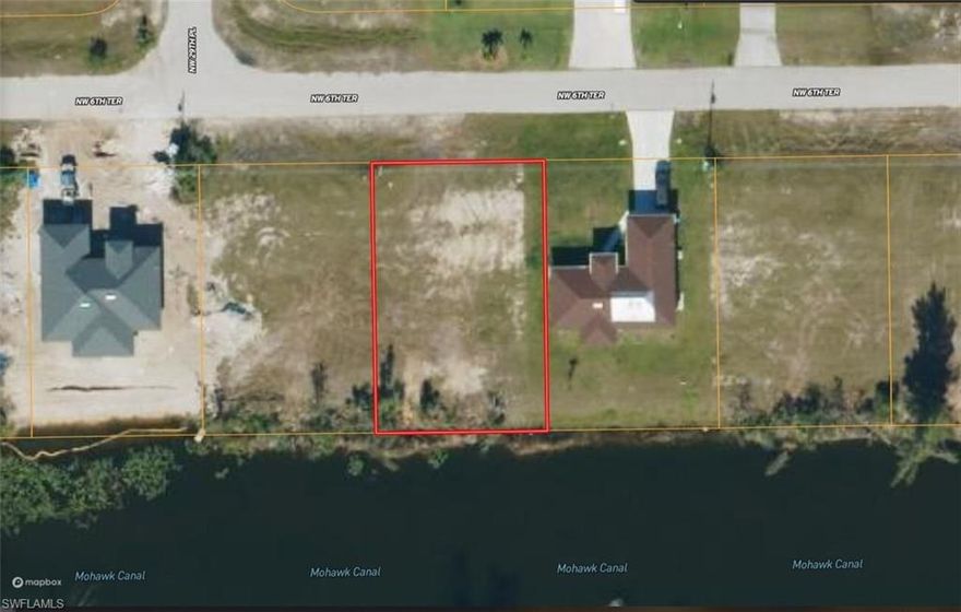 Build your Florida dream in a peaceful Cape Coral setting! This R-1 zoned residential property is located on NW 6th Terrace and borders a scenic canal, offering a quiet backdrop for a future home or investment. Some deed restrictions help maintain the area’s character. A well and septic will be needed, with electricity available at the nearest street. Perk test results are available upon request to help simplify your planning.

There may be burrowing owls on the property that will need to be moved if building is going to occur on the property.

Enjoy quick access to downtown Cape Coral for daily shopping, dining, and services, while Fort Myers is just 27 minutes away with golf courses, parks, restaurants, and attractions like the Calusa Nature Center & Planetarium. Outdoor lovers will appreciate proximity to Pine Island Sound Aquatic Preserve and Yucca Pens Unit State Wildlife Preserve for boating, fishing, and wildlife viewing.

A great opportunity to own canal-side land in a desirable Southwest Florida location.