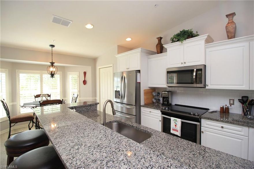 BEAUTIFUL 2nd floor Verranda with 1-car detached garage, features open concept family room & kitchen, vaulted ceilings with expansive lake views, front & back screened lanais, custom Plantation Shutters & updated flooring throughout. Newer kitchen appliances with plenty of cabinets & granite counter space, a counter height bar & separate breakfast nook for additional seating, & separate dining area ideal for entertaining. The den features custom built-ins for office space with queen Murphy bed. The 2nd bedroom also features custom built-ins. Master bedroom with 2 large closets & en-suite with double vanity. Desirable No Naples bundled golf community of CYPRESS WOODS GOLF & COUNTRY CLUB features an 18-hole championship course with a putting green & aqua range. Located near many of the area's attractions & conveniences, including county & state beaches & preserves, the Mercato, shopping & restaurants, places of worship, schools, medical care, I-75, & RSW Airport.  Community amenities include a clubhouse with an award-winning restaurant & bar, large heated community pool, lap pool, spa, 4 lighted tennis & pickle ball courts and fitness facilities with a studio for aerobics & yoga.