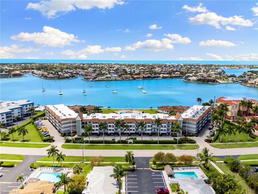 From the moment you open the door you are greeted by this beautiful and newly renovated 2-bedroom, 2-bath condo that spans approximately 1,400 sq. ft. with direct access to the Gulf.  This coastal residence with its warm and inviting atmosphere features stunning light wood floors, beautifully remodeled bathrooms and kitchen with a bright and open layout.  Enjoy breathtaking water views from the living space and large lanai with the convenience of a private dock available for only $600 annually.  Ideally located just steps from amazing restaurants and shopping, this move-in ready condo combines modern comfort with a fantastic location.  A rare find in Smokehouse Harbour!  Excellent opportunity for rental income if desired.