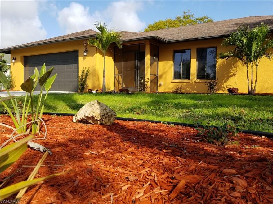 Fully Renovated! ASSESSMENTS PAID!! Don’t miss this opportunity, move in ready!! Home is located in an attractive neighborhood in SE Cape Coral. The house is a split floor plan with, 3 bedrooms, 2 bathrooms and a 2 car garage, vaulted ceilings and a spacious great/ family room. The entire main area of the home is complimented with tile throughout the house except the 2 guest bedrooms. Kitchen opens into family room / dining room area which means you're never far from the action. As you walk out to the screened, covered lanai, you will notice the canopy coverage created by the mature trees; including, gumbo limbo, oak, birds of paradise, sea grape and many more throughout the fully fenced back yard, which still has plenty of space for a pool. Central water, sewer and irrigation.