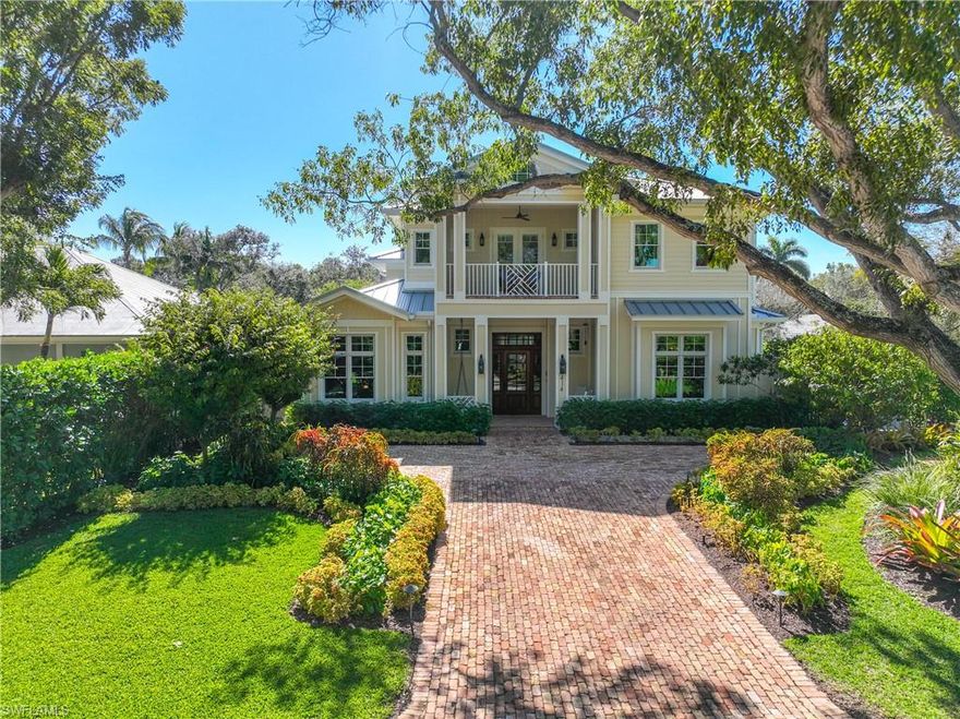 This stunning luxury home epitomizes the Naples lifestyle and is located just steps to sugar sand beaches and blocks to 5th Ave S. and the new Four Seasons. This rare southwest corner property is bathed in light and demonstrates the attention to detail a true custom home provides. European oak floors, beautiful woodwork and custom tile selections are the framework for an incredible floor plan designed for both intimate and large gatherings. The public rooms include a large living room with custom built-ins, dining area and walk behind bar. The chef’s kitchen features a dual fuel Wolf Range, convection/steam and microwave ovens, Sub-Zero refrigerator/freezer, two Bosch dishwashers and plenty of storage. The first floor primary suite boasts a wet bar, sumptuous spa-like bath with dual vanities, soaking tub, and indoor and outdoor showers. Walls of sliding glass reveal an outdoor oasis with a summer kitchen, living and dining areas, two-sided fireplace, vine-covered pergola, pool and spa. Upstairs is a large rec room, wet bar, 3 en suite bedrooms and a private guest suite. With countless additional amenities, this is the ultimate home to enjoy all Naples has to offer.