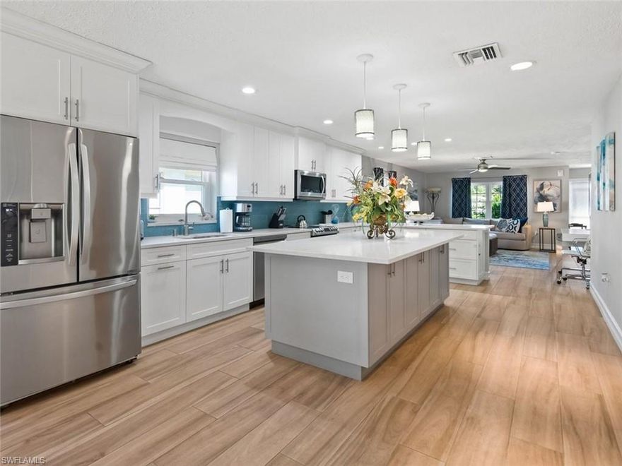 Available in the highly desirable Naples Park neighborhood, this beautifully updated 3-bedroom, 2-bath single-family home offers 1,600 sq ft of stylish living just one mile from the white sandy beaches of Denler-Wiggins Pass State Park and Vanderbilt Beach. This furnished residence features a brand-new heated saltwater pool, screened lanai, and a fully fenced backyard perfect for enjoying the Southwest Florida lifestyle.
The thoughtfully designed interior includes tile flooring throughout with no carpet, quartz countertops, a kitchen island with breakfast bar, and updated finishes throughout. The spacious primary suite features a king bed and private en-suite bathroom, while the additional bedrooms include a queen room and a twin room.