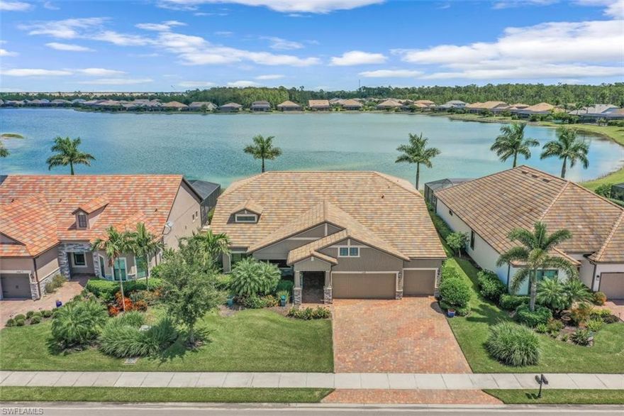 This magnificent Clubview lakefront estate home is located on one of the most beautiful expansive lake lots in the community. With many designer upgrades including; upgraded tile floors, gourmet kitchen with upgraded cabinets & stainless steel appliances, whole house reverse osmosis, crown molding throughout, largest extended pool and lanai area  in the neighborhood that encompasses a custom heated pool and spa with a sun shelf and multi-colored LED lighting, impact windows and doors, extended 4 ft garage, beautiful landscape lighting, whole house generator and surge protector and a beautifully finished summer kitchen in lanai.  Corkscrew Shores offers Resort Style amenities including a 240 acre neighborhood lake, restaurant/bar, clubhouse, resort-style community pool, kayak & canoe launch, fishing pier, fire pits, massage therapy room, 5 Har-Tru tennis courts, pickleball courts, bocce ball, state of the art fitness center, movement studio, playground, & walking trails.