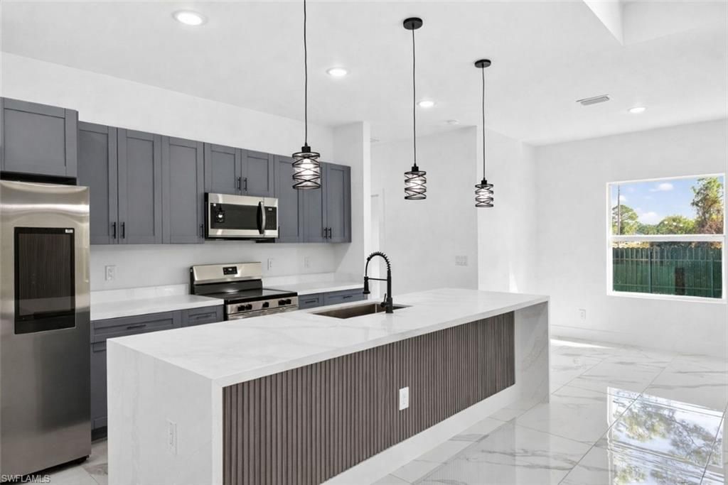 Photo of 801 Pinecastle DR, LEHIGH ACRES, FL 33974 (MLS # 226005467)