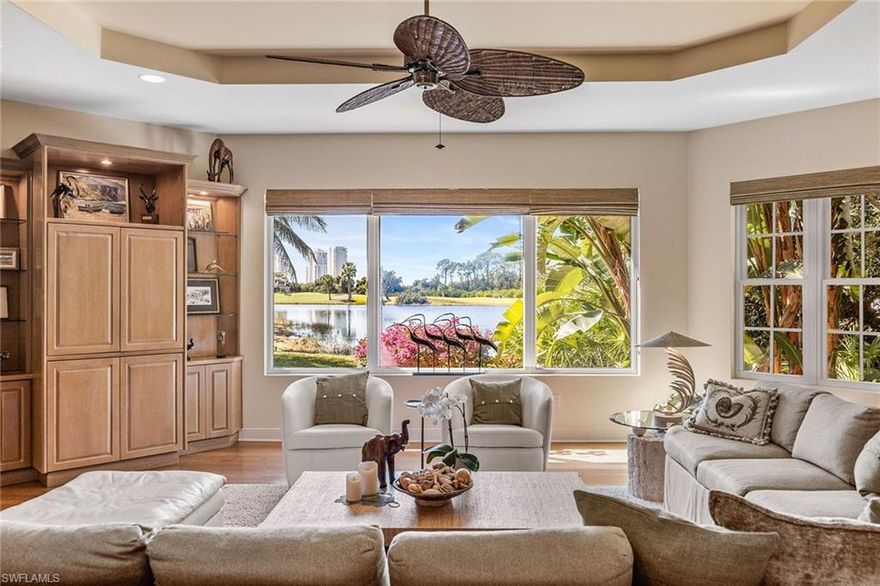 Welcome to 4441 Blue Sage Court in Pelican Landing, an incredible Old Florida-style residence offering timeless charm, thoughtful updates, and a breathtaking setting. This 4,031-square-foot single-family home features three bedrooms, 3.5 baths, a den/office, and an oversized 2.5-car garage, all positioned on a lushly landscaped .68-acre corner lot with sweeping views of the lake and golf course. Go onto the spacious front porch and into an inviting formal living and dining area, designed for entertaining. French doors lead seamlessly to the expansive pool and outdoor living space, blending indoor and outdoor enjoyment. The updated kitchen opens to a warm and welcoming family room with an eating area, creating a comfortable setting for everyday living, gathering and relaxed conversation. A private first-floor home office/den features beautiful arched windows that fill the space with natural light. A standout feature is the 2014 second-floor addition, designed for style and versatility. This space includes a bath, a bar area with wine refrigerator, a built-in desk and a flexible bonus area, ideal for an additional office den, or even guest space. Go outside to your private retreat where the spacious pool area captures stunning panoramic views of the sparkling lake, manicured golf course and tropical surroundings, a Florida paradise. As a resident of Pelican Landing, you’ll enjoy an unmatched lifestyle with resort-style amenities including a private island beach pavilion, sailing, a kayak park, tennis, pickleball, bocce and an attended fitness center, with optional golf membership available for those who want the full country club experience. Classic charm, modern functionality and an unforgettable view, this is Pelican Landing living at its finest.