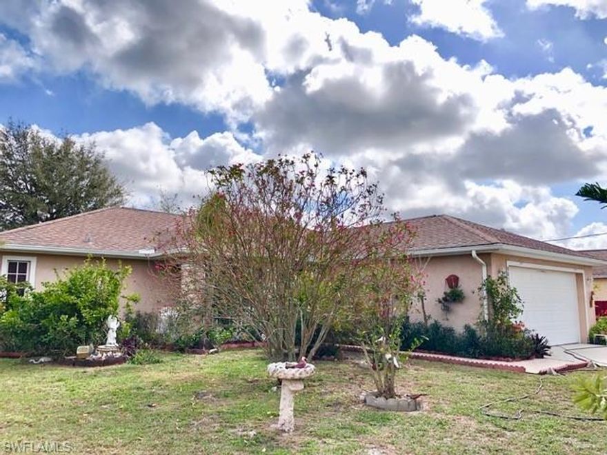 BETTER THAN NEW! Why spend extra for fencing, sheds/storage and other upgrades??!! This very well maintained 3 bedroom, 2 bath single family home is located in Port LaBelle. The property boasts a privacy fence , security lights in the back, 2 storage sheds, hurricane shutters and an additional awning shelter in front of the two-car garage. The home's interior features cathedral ceilings, a cozy breakfast bar, a master bath with a garden tub and a large shower as well as a tiled screened-in porch, perfect for entertaining family and friends.