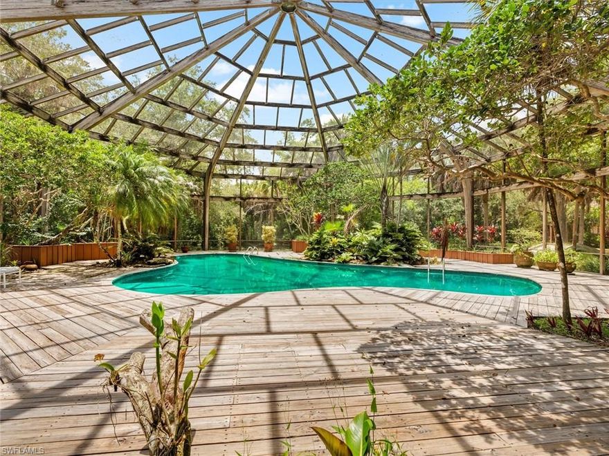 This 12-acre property presents a rare opportunity for investors, developers, or end users seeking usable acreage close to downtown Naples and the airport. With Estate zoning (“E”) already in place, the land is ideal for creating five well-sized parcels or two large estate lots, each with ample room for car barns, warehouse-style storage, hobby shops, RV or boat garages, and other “toy-friendly” outbuildings. 

The setting is quiet and private, making it an excellent fit for a small, exclusive estate community or for buyers looking to build expansive compounds with both lifestyle and functional space. Existing improvements include a 1980 A. Vernon Allen–built home, along with a tennis house and court positioned around a pond and footbridge. These structures can remain or be removed depending on the desired direction of the project. 

With its size, zoning, and prime location, the property is straightforward to plan and develop - whether the vision is five premium homesites, two signature estates, or another low-density concept. Higher-density possibilities also exist under current zoning, offering added flexibility for future strategies. 

A true acreage rarity in Naples, offering multiple clear paths for value creation - practical, flexible, and ready for its next chapter.