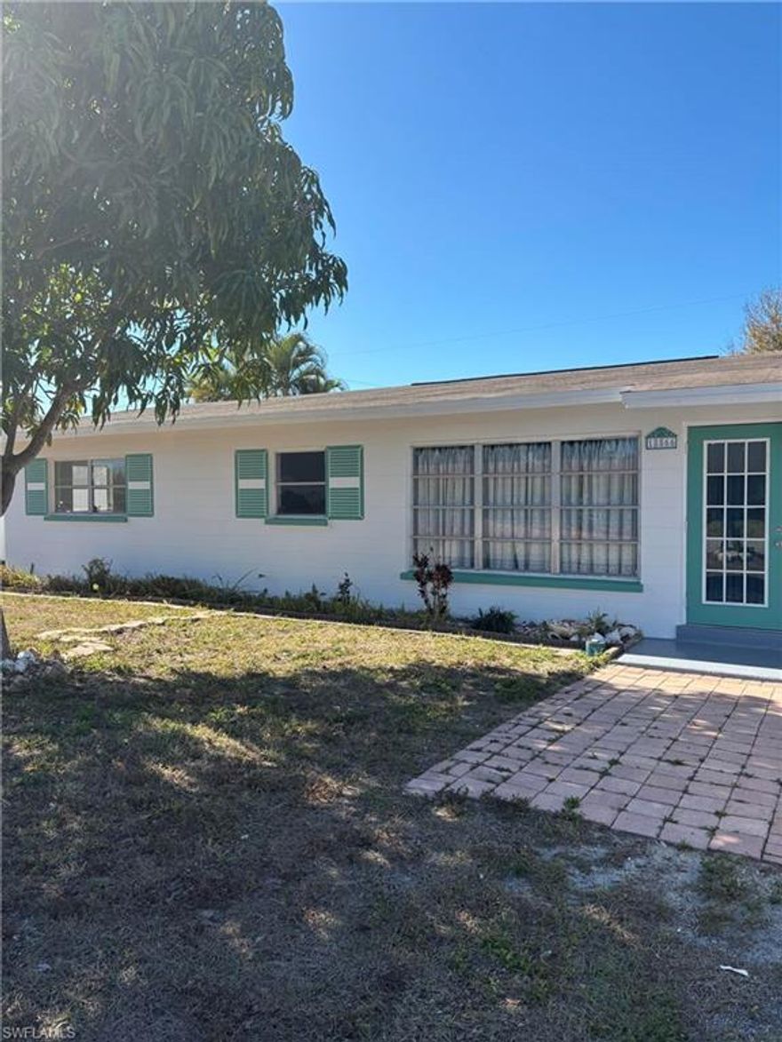 Location! Location! Location!  Welcome to the desirable San Carlos Park subdivision, in an HOA-Free zone!  This unique property is situated in an excellent neighborhood, within 1 mile of San Carlos Golf Club and the Estero WalMart, and within walking distance to MANY local amenities. In addition to exceptional walkability, this charming home is less than a mile from the KJ Drew Community Center & Pool, is in close proximity to 5 fire stations, an assortment of schools, and is a short 15 minute drive to Gulf Coast, Miramar or Coconut Point shopping!  This 3 bedroom property, includes a master w/ en suite bathroom (shower), a main bathroom w/ tub/shower combo, cozy kitchen w/ breakfast bar, & comfortable living room, adorned with tile throughout.  A generous utility room off the carport is accessed via a separate entrance.  The ample front yard showcases a mature Mango & accompanies an oversized, fenced backyard with Peach, Fig, Avocado, Bamboo &  Banana.  A roomy outdoor shed, situated in the rear & built of the same hardy concrete block as the main house also features a fully functional shower.