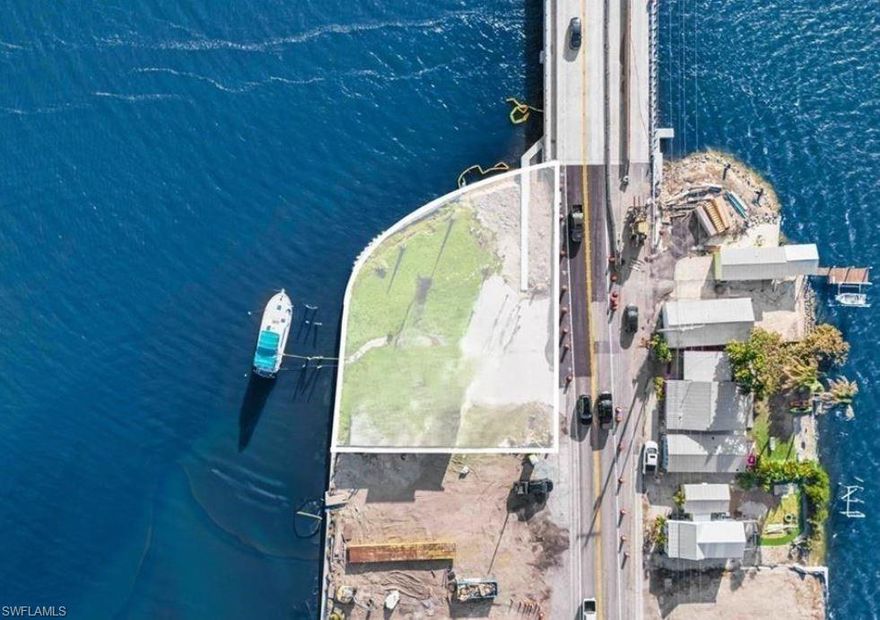 Exceptional opportunity with prime commercial or single-family home potential to own a rare waterfront parcel in the heart of Matlacha! Situated on over a ¼-acre, this unique property offers breathtaking 360-degree views of Matlacha Pass, Little Pine Island Nature Preserve, and the charming historic fishing village of Matlacha. Enjoy spectacular sunrises and unforgettable sunsets from this prime island location. A true blank canvas for development, this property also presents excellent commercial potential with its desirable C-1 zoning. Whether you envision building a custom waterfront dream home, creating a multi-unit income-producing property, establishing a live/workspace, or developing a boutique commercial venture, the possibilities here are extensive. Zoned C-1, this parcel allows for a variety of residential and commercial uses—ideal for investors, builders, or visionaries looking to capitalize on Matlacha’s vibrant and growing community. Walking distance to popular restaurants, art galleries, boutiques, entertainment, and local seafood markets, this location blends island charm with convenience. Surrounded by world-class fishing, nearby Gulf beaches, and direct access to the Gulf of Mexico, the lifestyle appeal is unmatched. With ample space for parking and potential dockage, this property offers the chance to create something truly special in one of Southwest Florida’s most sought-after waterfront destinations. A structure currently exists on the property and is not habitable. Buyer to conduct all inspections and due diligence.