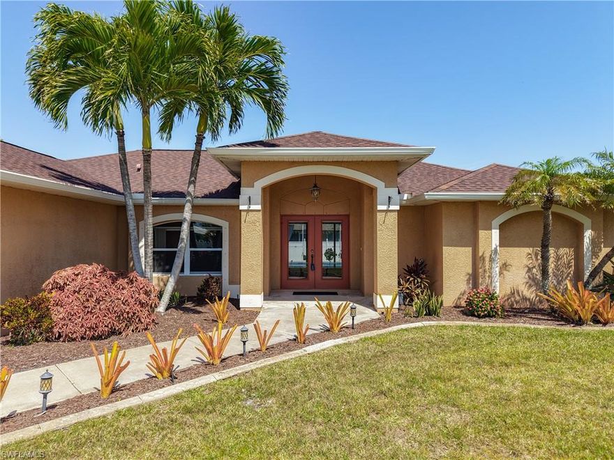WOW! POOL home with 3 Bedrooms plus a den/office, 2 bath and 2 car garage located in SW Cape Coral! The moment you walk in the front door your view is of the pool thru the triple pocketing sliding glass doors! The kitchen has Granite Counters, large stainless single vessel sink, stainless Kenmore appliances and custom Cherry cabinets with decorative brushed nickel pulls. This 1631 sq ft home features a great room floor plan with the Master Suite on one side of the home and the two guest bedrooms and guest bath on the other side. Master Suite features a slider to the pool, his and her walk in closets, dual sinks, a walk in shower, and a private toilet room. The guest bedrooms are a great size and each has a walk in closet. The guest bath has a door directly out to the pool. The pool was recently resurfaced ( 2022) along with a new blue tile edge and decorative blue diamond tiles on the stairs and the lounging seat. The decorative concrete Pool deck was completely re-done (2022) NEW pool pump(2021) and NEW pool heater(2023). Oversized under truss lanai for outdoor living/entertaining and an area to suntan/ lounge on this pool deck which is completely screened- in. NEW AC in 2021. NEW Roof in 2021. NEW garage door opener in 2021 and the garage door, springs and cables were all replaced in 2024. Fenced in back yard has a 6 ft white privacy fence. Tons of palms and tropical landscaping and even banana Trees in the back yard. Automatic sprinkler system. Corrugated steel storm shutters for all windows.  ALL ASSESSMENTS PAID. NOT in a flood zone. Come see this one!