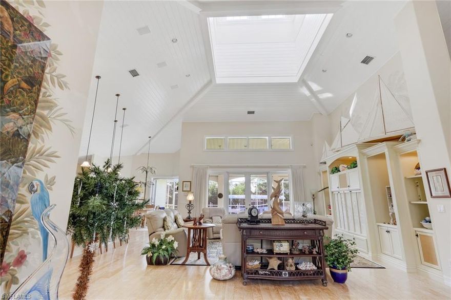 Premier waterfront residence positioned on the Jewel Box Canal, offering direct, no-bridge boating access to Naples Bay and the Gulf of America via Gordon Pass. The Jewel Box Canal is among the widest, deepest, and most navigable waterways in Oyster Bay and Royal Harbor. This 3-bedroom plus den, 3.5-bath home offers a flexible floor plan, with the den easily convertible into a 4th bedroom, and is thoughtfully designed around light, volume, and seamless indoor-outdoor living. The interior is defined by soaring ceiling heights, custom architectural millwork, and hand-applied trompe-l’œil artwork, creating a refined coastal aesthetic with subtle lighthouse-inspired character. Natural light fills the main living spaces, emphasizing the home’s vertical scale and quality construction. Outdoor living is defined by a seamless connection from the open interior living spaces to the waterfront, where an expansive dock serves as the focal point and flows naturally into the pool and spa, creating a unified indoor-outdoor environment. Located just minutes from Tin City, Cabana Bayfront and Downtown 5th Avenue, this property pairs true Gulf-access boating with immediate proximity to Naples’ most elite dining, shopping, and lifestyle destinations. Schedule your private tour today so you can experience the residence firsthand.