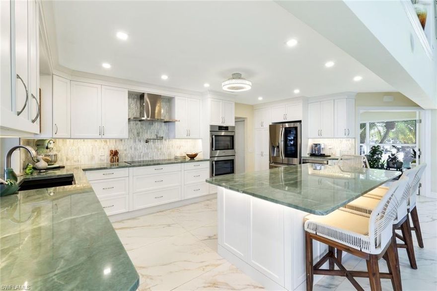 Stepping into this home, you’re immediately welcomed by a bright, open living space designed for both comfort and entertainment. The expansive great room flows seamlessly into the chef’s kitchen, with exotic Brazilian Quartzite countertops, a large center island with generous seating, Bosch double ovens, cooktop, and dishwasher, LG refrigerator makes dual ice, Sharp Pull-out drawer Microwave,  A pot-filler and Kraus sink create a true culinary experience. A full bar with matching Brazilian Quartzite, beverage cooler and icemaker opens to the living area complete with a fireplace, making the entire space ideal for gatherings. 2024 updates include all new kitchen cabinetry, new porcelain 3x3 tile floors throughout the entire first floor.  Impact windows and doors throughout, with the exception of one upstairs slider equipped with manual hurricane shutters.
A flex room is off the living area. The first floor also offers a large bedroom, a bathroom with double vanity with leather granite and walk in shower.  A large laundry room with cabinets, granite countertops and utility sink. 
Large sliders open to offer indoor/outdoor living.  Stepping out, you’re greeted by the ultimate waterfront lifestyle. Relax by the pool while watching dolphins and manatees glide through the wide, deep-water canal. With 80-foot frontage on a true DEEP waterway canal, this property is yacht ready and can accommodate substantial vessels.  Your boating options are endless with quick access to the Gulf from your private dock. The outdoor living areas include a covered seating space, screened lanai around the pool, and a large open pavered sun deck overlooking the canal. A vinyl louvered privacy fence provides privacy and the circular driveway adds ample parking.  A metal roof and Certainteed Cedar Shingles for maintenance free living
Back inside, the spiral staircase leads to a loft with a Murphy bed adding flexible sleeping or workspace options with windows overlooking the water. The oversized primary suite provides a private retreat with a sitting area.  The primary bath offers a large walk in shower, a jetted tub, double vanities and double sinks. The impact French doors from primary suite lead to an upper deck and cat walk with Brazilian wood railing.   Enjoy the sunrise from the back deck and sunsets from the front deck.  
Being sold furnished, this home offers perfect waterfront living. Minutes to Fort Myers Beach by boat or car.  One of the best opportunities in Siesta Isles and SW Florida!!
