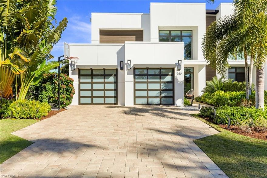 Welcome to your Urban Oasis! Located in The Moorings with access to The Moorings Private Beach, this home exudes luxury.  Architectural excellence is everywhere, from the initial curb appeal of the home throughout the entire living space. The home features two master suites, one on the ground floor, 1 additional en suite bedroom upstairs and one bedroom downstairs. As you enter the home the floating stairs and clean modern style capture your attention. The living space is an entertainers dream with a large open kitchen, huge granite island, custom cabinets, Thermador, U Line and Bosch appliances and a large hidden walk-in pantry. The wall of sliding glass doors open to allow the living space to become a complete indoor outdoor experience. Step outside and enjoy peaceful evenings by the outdoor fireplace with the relaxing water feature of your private heated spa. Walking distance to the white sandy beaches of The Gulf of Mexico and minutes to Olde Naples this location is second to none.