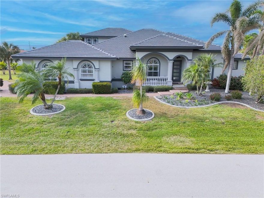 UNPRECEDENTED OPPORTUNITY — $300,000 PRICE REDUCTION! Sellers say SELL! Motivated sellers have slashed the price by $300,000, creating the best waterfront value in Punta Gorda Isles at just $368/sqft! This spectacular 3-bedroom, 3-bathroom sailboat-access estate on a premium DOUBLE LOT is now priced to move fast. With 95 feet of seawall and open water access, this is your chance to own a piece of paradise at an unbeatable price. WHY THIS IS THE DEAL OF THE YEAR: At $1,295,000, this home is priced significantly below recent comparable sales and offers more lot, more seawall, and more luxury than anything else on the market. The sellers have already invested in all the expensive upgrades — new tile roof (2023), impact windows throughout, fresh paint inside and out, state-of-the-art appliances, and a gas-heated saltwater pool with spa. You're essentially stealing their equity! THE HOME: This architectural masterpiece showcases soaring double tray ceilings, 8-foot doors, and a split floor plan that lives like a much larger home. The gourmet kitchen features rich wood cabinetry, granite counters, gas range, and convection oven — all overlooking stunning canal views. The flexible den with French doors easily converts to a fourth bedroom. The master suite is a true retreat with private lanai access, oversized walk-in closet, and spa-inspired bathroom. THE LIFESTYLE: Your private resort awaits with a newly paved lanai, summer kitchen perfect for entertaining, and western exposure for spectacular sunsets every evening. The 14,000lb boat lift and concrete dock put you minutes from world-class fishing and boating. Located on a peaceful double lot in prestigious Punta Gorda Isles, you'll enjoy city-maintained seawalls and all the benefits of this premier waterfront community. THE BOTTOM LINE: The sellers have done all the work — now it's your gain! With whole-house hurricane protection, 2-zone A/C, tankless water heater, and an alarm system, this home is move-in ready. From the elegant Honduran mahogany front door to the brick-paver driveways, every detail reflects quality and care. This aggressive pricing won't last. At $368/sqft, this is the waterfront opportunity serious buyers have been waiting for. Schedule your showing TODAY before another savvy buyer recognizes this incredible value!